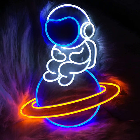 Astronaut Sitting on Planet Neon Sign
