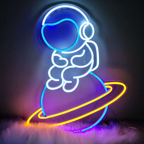 Astronaut Sitting on Planet Neon Sign